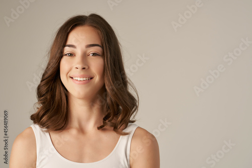 cheerful woman posing glamor cosmetics isolated background