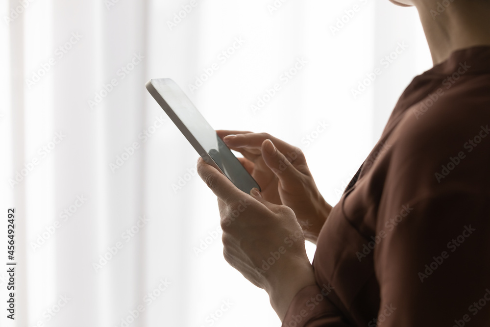 Using online app. Close up of young woman user of modern smartphone gadget. Happy gen z female browse internet on phone type message in dating chat dial number swipe quick menu on screen. Copy space Using online app. Close up of young woman user of modern smartphone gadget. Happy gen z female browse internet on phone type message in dating chat dial number swipe quick menu on screen. Copy space