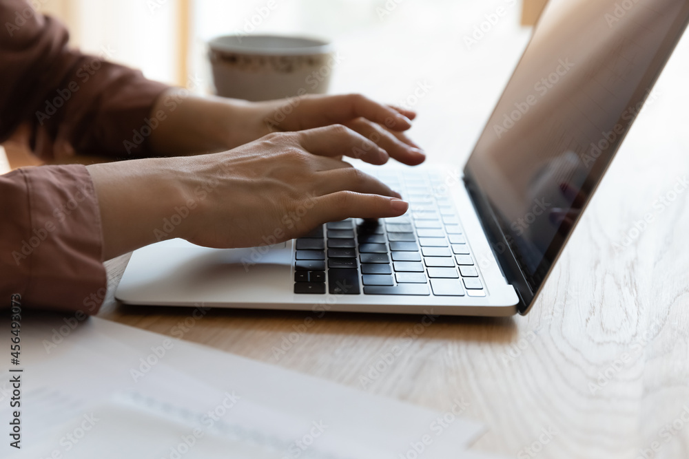Computer work. Close up of young woman teleworker student hands typing text on laptop. Female freelancer use modern pc to search information news at web online prepare electronic document write email Computer work. Close up of young woman teleworker student hands typing text on laptop. Female freelancer use modern pc to search information news at web online prepare electronic document write email