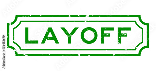Grunge green layoff word rubber business seal stamp on white background