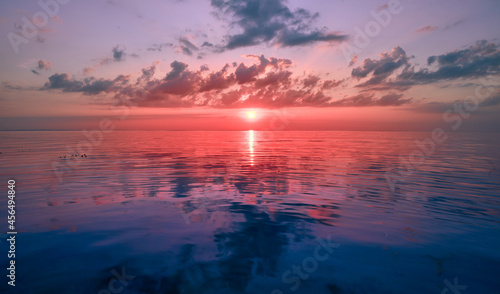 Photo of a sunset on the sea. Evening landscape, moroe, waves, sunset. © Sergey