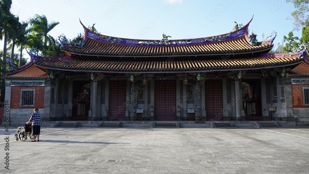 Social distancing the elderly alone in the Chinese temple in the day time 