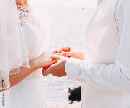 bride and groom holding hands