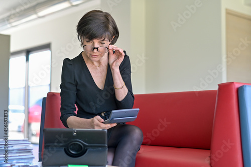 Portrait of a businesswoman sitting in a waiting room preparing for her meeting © ElitProd