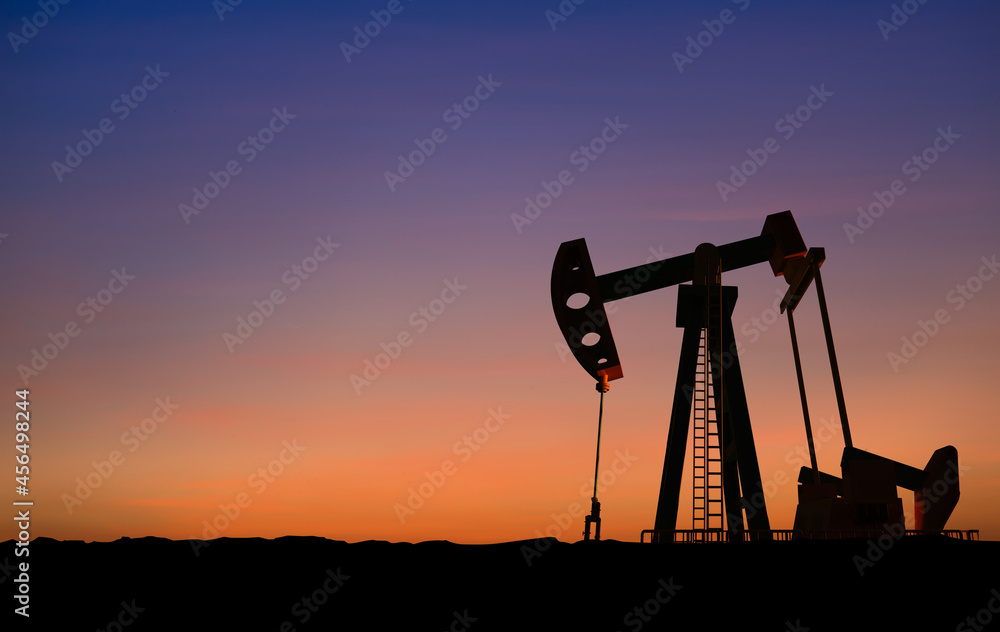 Crude oil pump or oil rig sunset