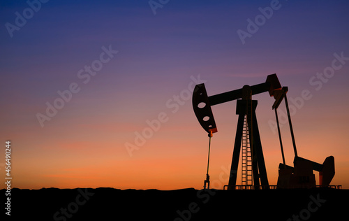 Crude oil pump or oil rig sunset