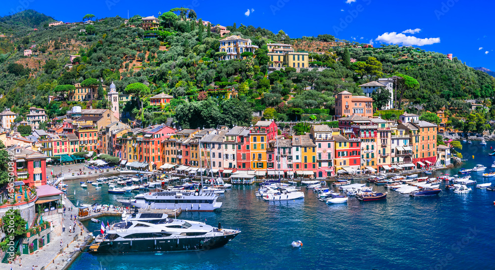 most beautiful coastal towns of Italy - luxury Portofino in Liguria, Panoramic view with colorful houses and sailing boats