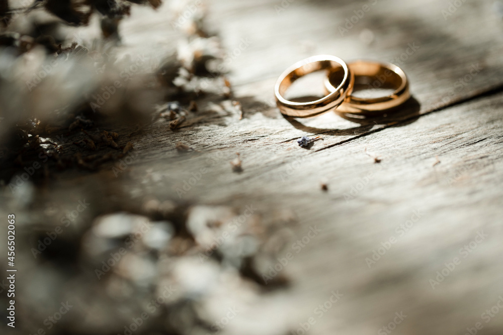 wedding rings on a bouquet of flowers wedding rings on a bouquet of flowers