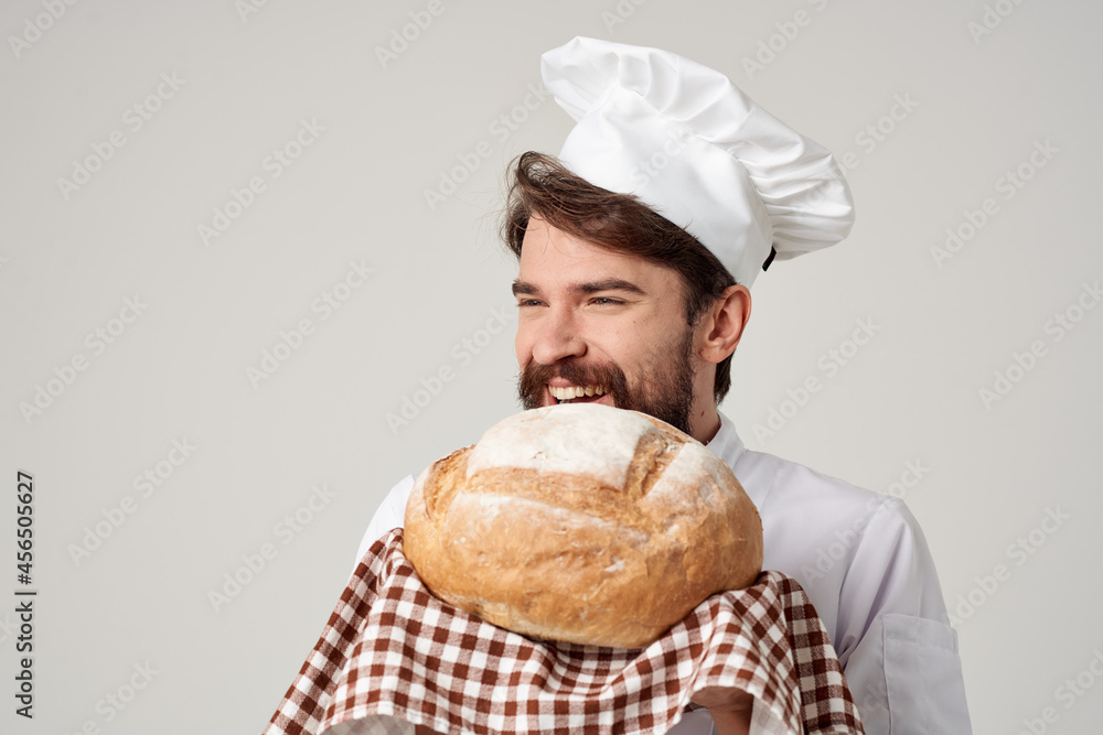 bearded man chef with bread in hand isolated background bearded man chef with bread in hand isolated background