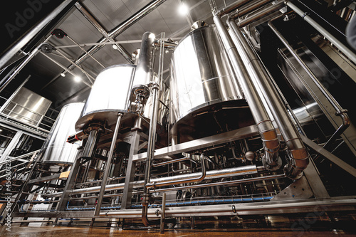 Rows of steel tanks for beer fermentation and maturation in a craft brewery