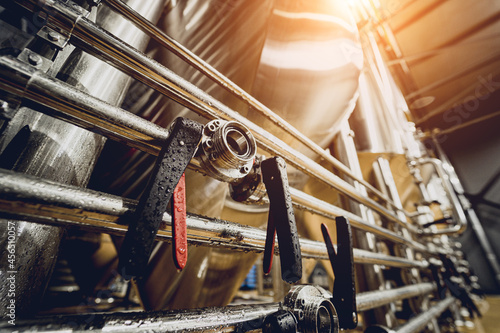 Rows of steel tanks for beer fermentation and maturation in a craft brewery