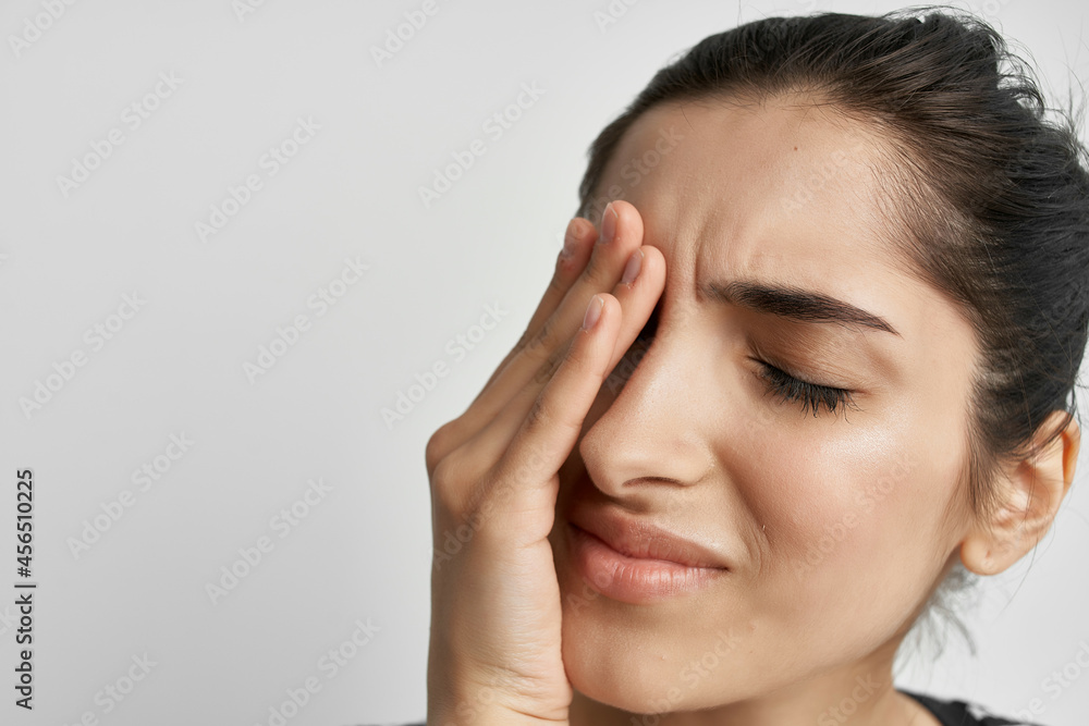 woman holding his head migraine depression light background woman holding his head migraine depression light background