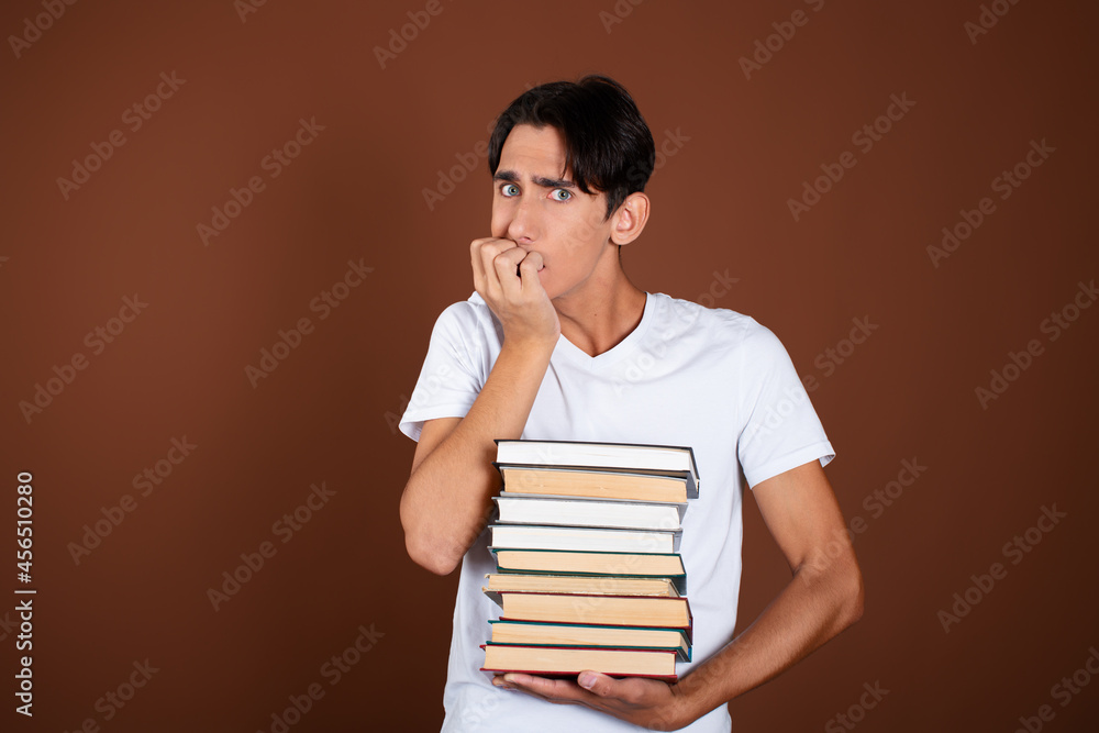 Rest and study at the university. Handsome guy with books. Rest and study at the university. Handsome guy with books.