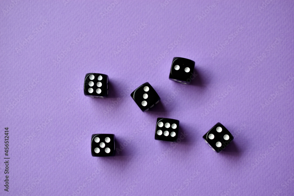 Dice are black and white on a purple background Dice are black and white on a purple background