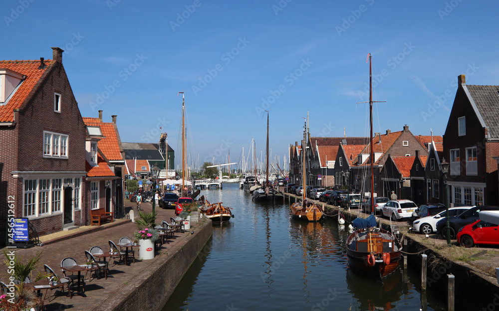 Beautiful Dutch city on water. Classic Dutch architecture. Sunny day city view. Authentic houses of the Netherlands. 