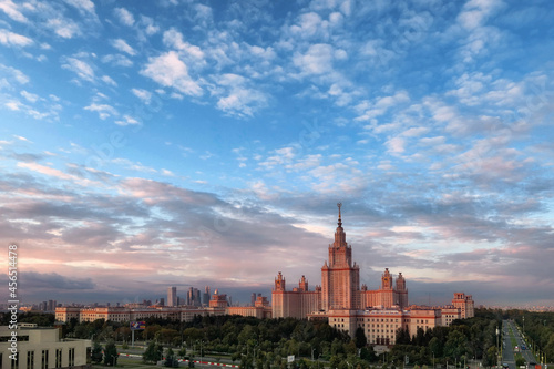 Aerial panoramic view of sunset campus buildings of famous Moscow university under dramatic cloudy sky in autumn