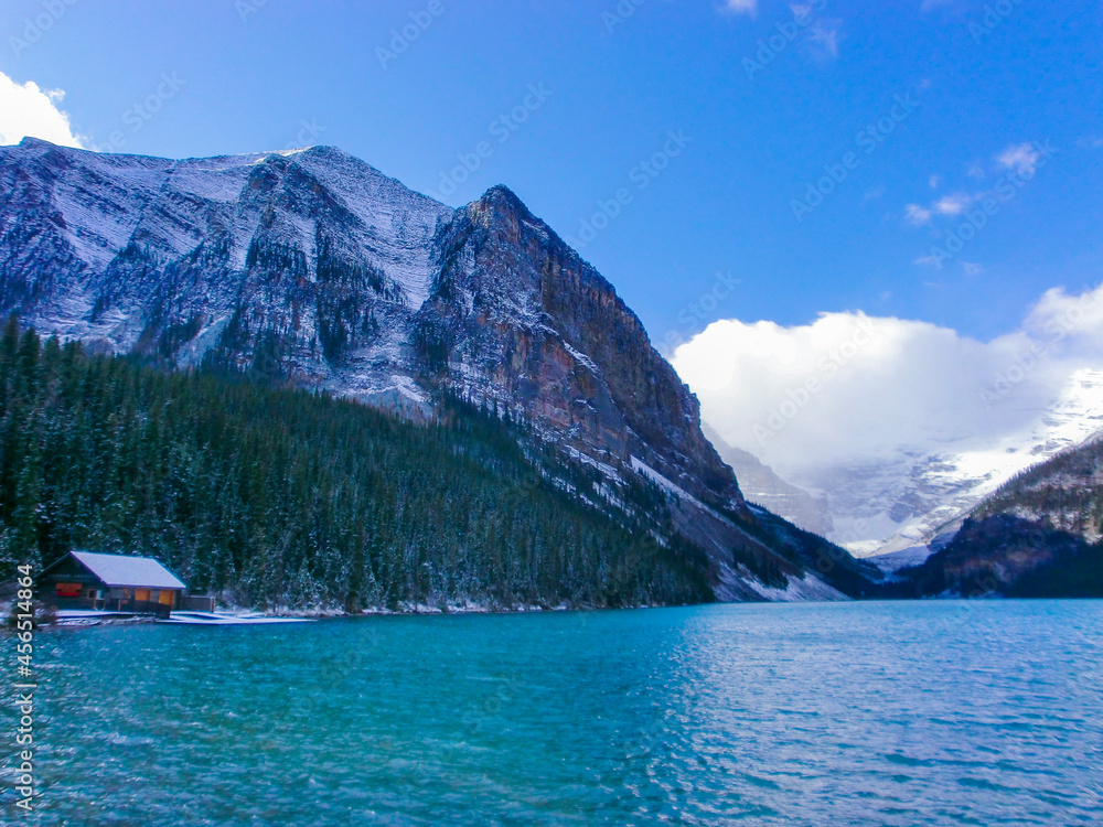 Picturesque Canadian landscape with lake, conifers and snow-covered mountains | Lake Louise, Canada