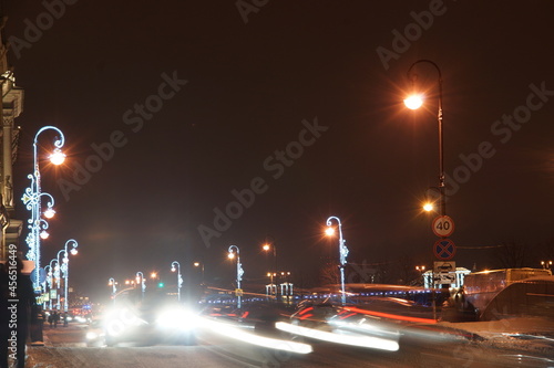 Lanterns decorated with garlands on the background of the festive city photo