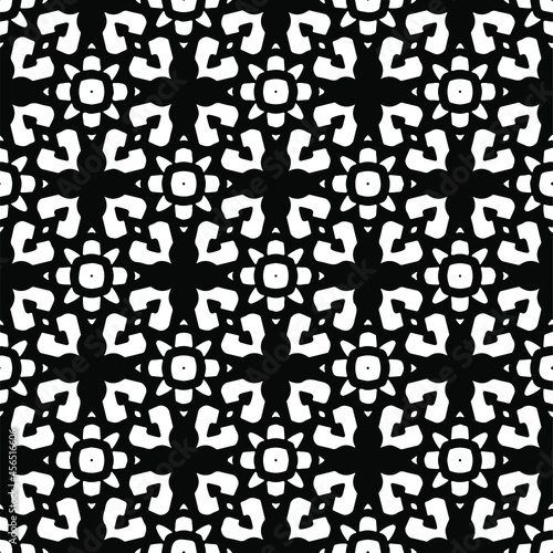 Flower geometric pattern. Seamless vector background. White and black ornament. Ornament for fabric, wallpaper, packaging. Decorative print