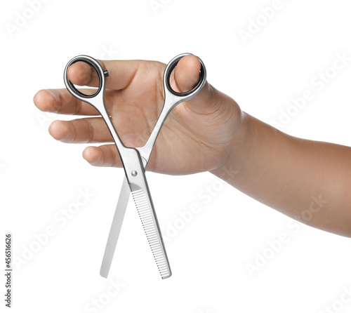 Hairdresser holding professional thinning scissors isolated on white, closeup. Haircut tool