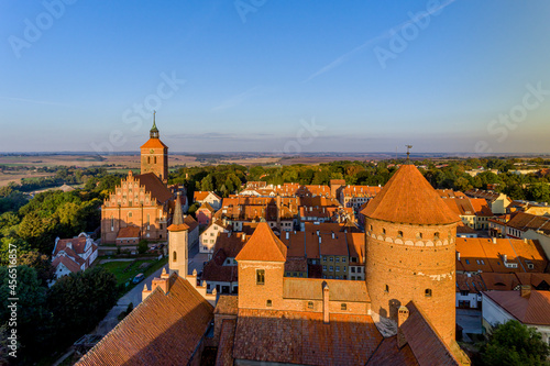 Panorama of the city of Reszel at sunrise, Castle and the Church of the Holy Apostles Peter and Paul in Reszel - Warmia and Masuria, Poland