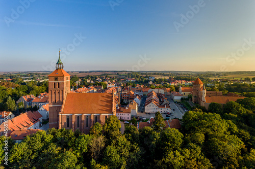 Panorama of the city of Reszel at sunrise, Castle and the Church of the Holy Apostles Peter and Paul in Reszel - Warmia and Masuria, Poland