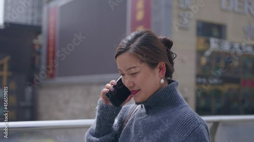 Wallpaper Mural 4k slow motion of one young pretty asian business woman walking in the street talking on the mobile phone Torontodigital.ca