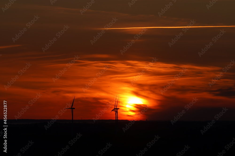 sunset with wind turbines