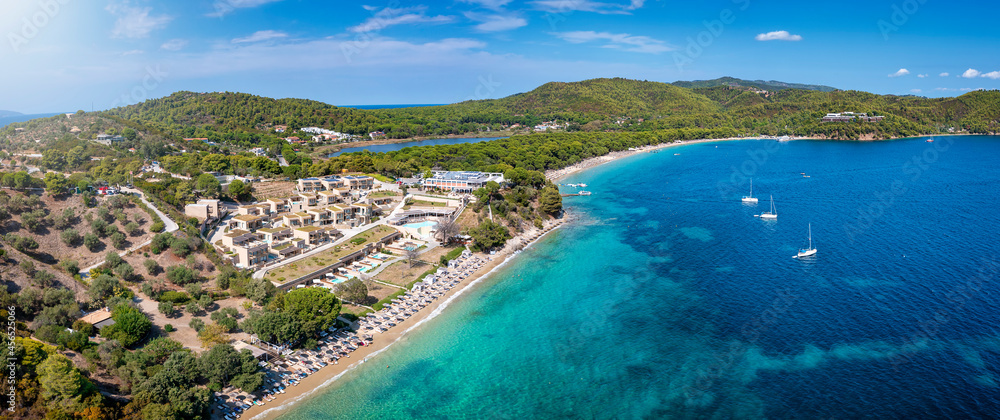 Panoramic aerial view to the bay of Koukounaries with Xenia Beach in the foreground, Skiathos island, Sporades, Greece