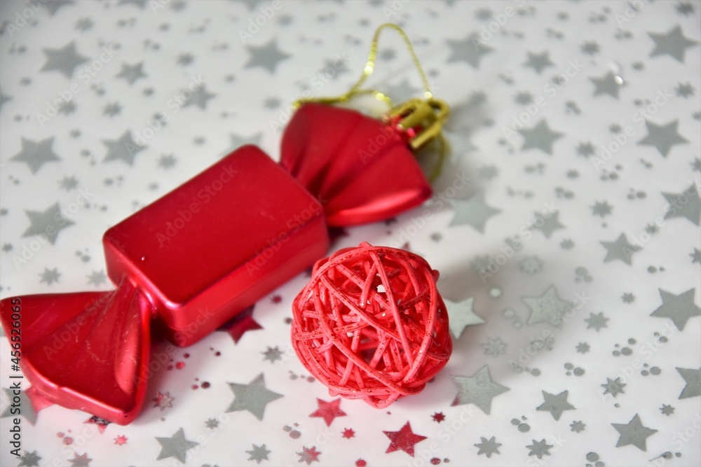 Christmas decorations, balloon and candy on white starry background Christmas decorations, balloon and candy on white starry background