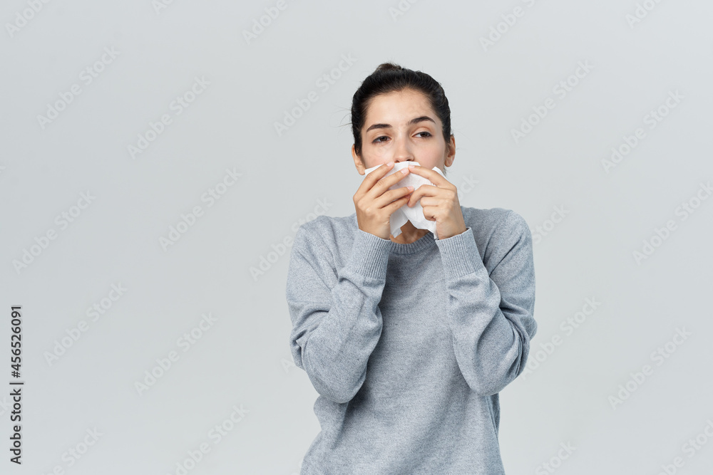 woman with handkerchief runny nose cold infection woman with handkerchief runny nose cold infection