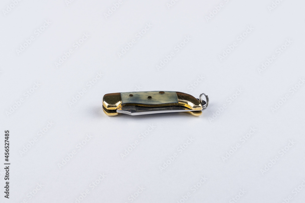 Miniature pocket knife isolated on white background Miniature pocket knife isolated on white background