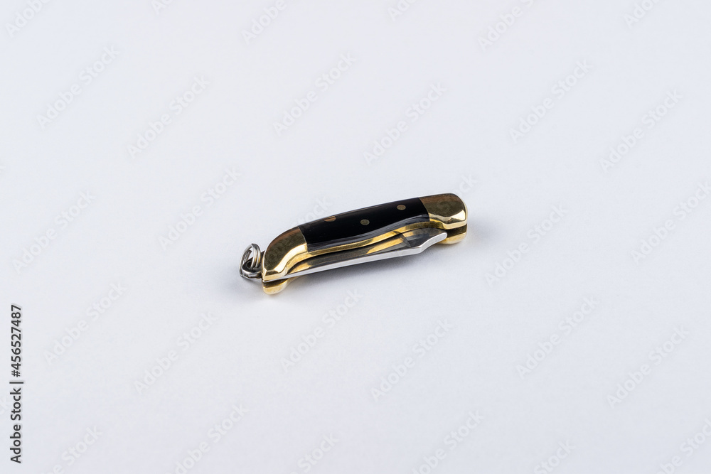 Miniature pocket knife isolated on white background Miniature pocket knife isolated on white background