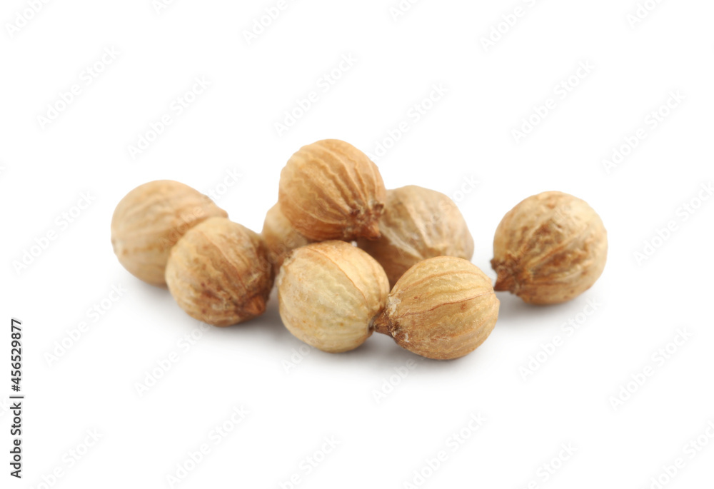 Heap of dried coriander seeds on white background, closeup Heap of dried coriander seeds on white background, closeup