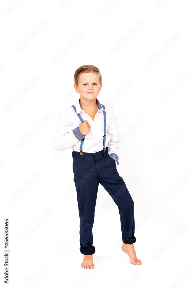 Cute boy child stylish in a white shirt on a white isolated background Cute boy child stylish in a white shirt on a white isolated background