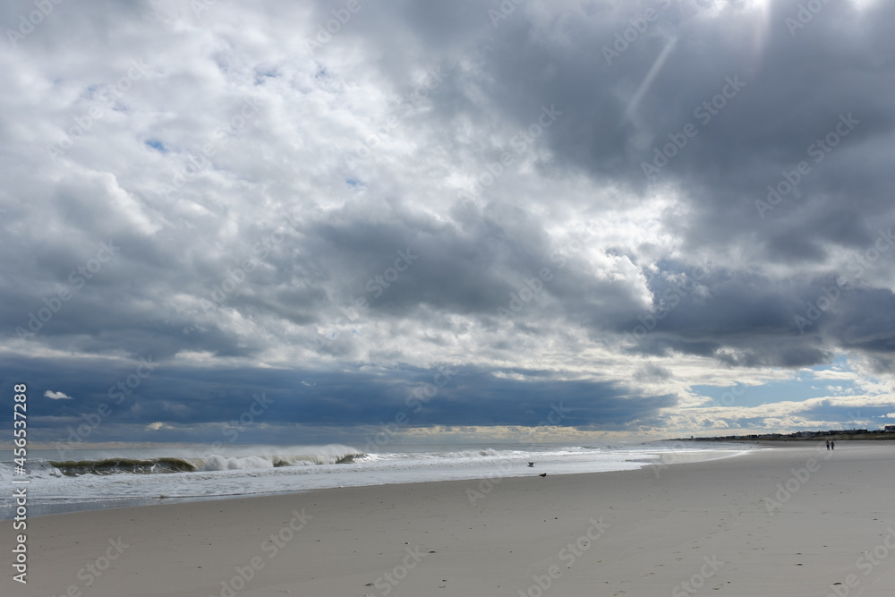Threatening skies and empty east coast beach in early winter Threatening skies and empty east coast beach in early winter