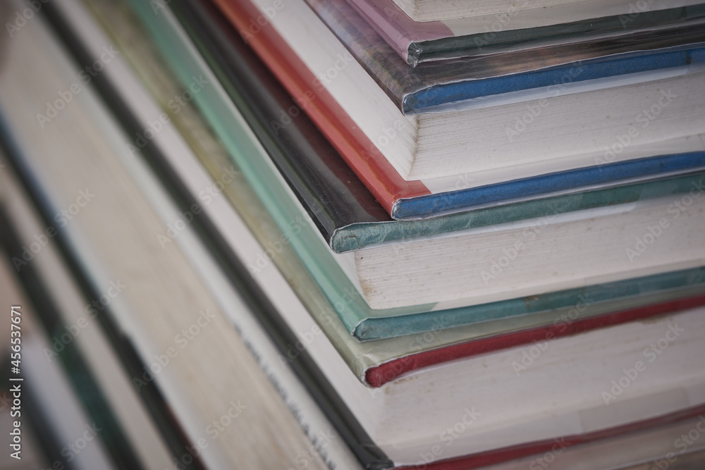 Old reading books stacked on a warehouse floor Old reading books stacked on a warehouse floor