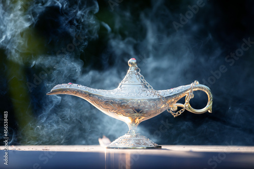 Aladdin lamp of wishes in magic smoke