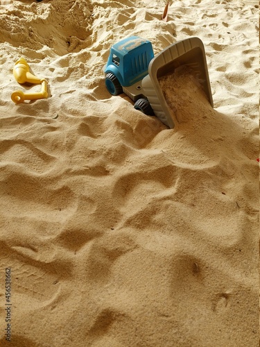 colorful and various plastic tools in the sandpit for children to play all the time design for  education concept