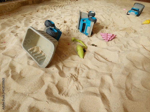 Bild auf Leinwand colorful and various plastic tools in the sandpit for children to play all the t