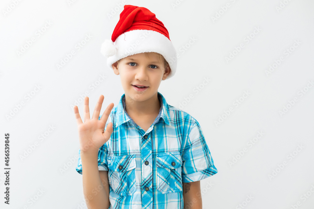 Boy dressed as Santa Claus isolated on white background Boy dressed as Santa Claus isolated on white background