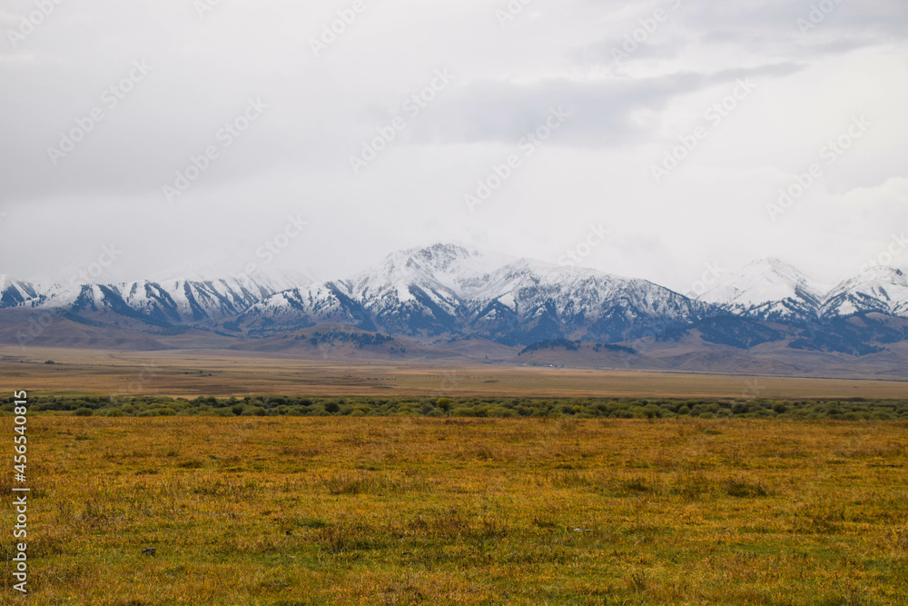 Kazakh steppe with the Pamir mountains in the background