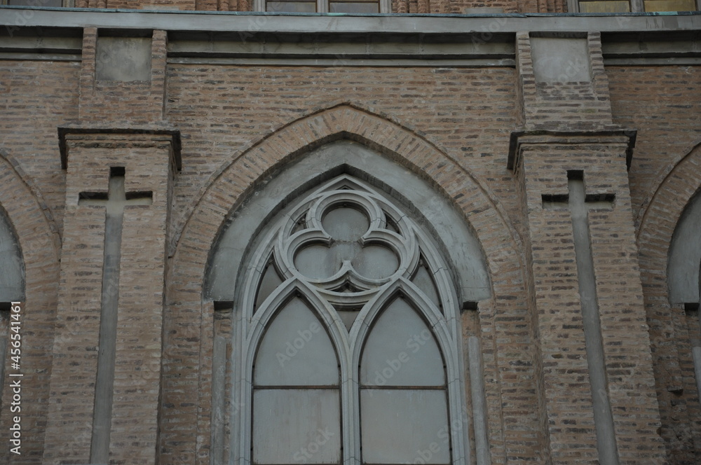 Neogothic window gracing the basilica's wall