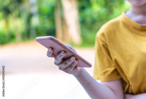 Hand with smart phone black screen blurred