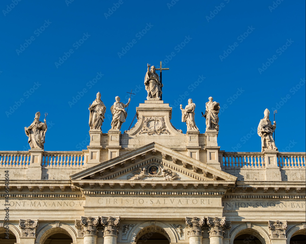 Statues on the roof of  the Papal Archbasilica of St. John in Lateran (Basilica di San Giovanni in Laterano), Italy, Rome