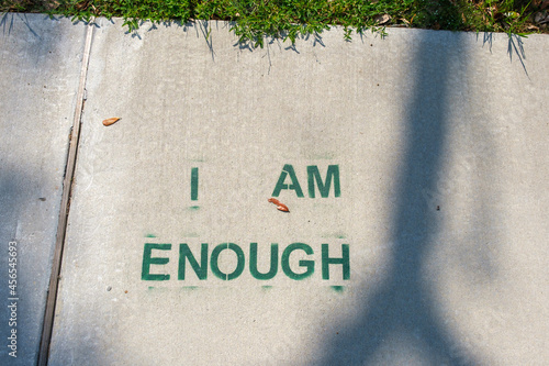Fotografía "I Am Enough" Stenciled on Sidewalk