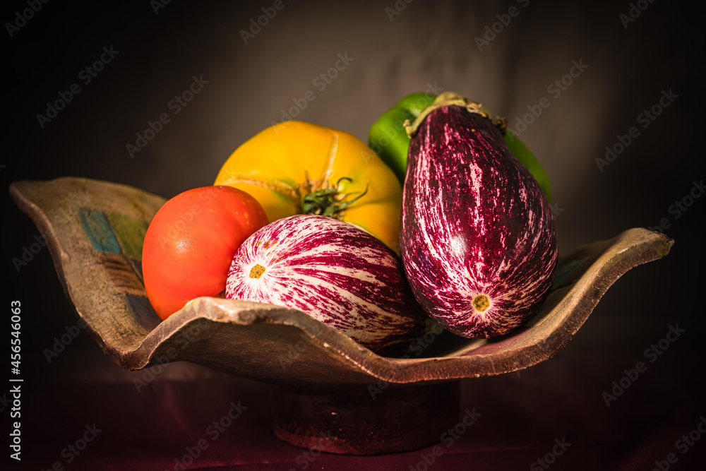 still life with eggplant, tomatoes and green pepper