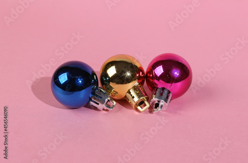 Christmas balls toy on a pink background. Minimal christmas concept