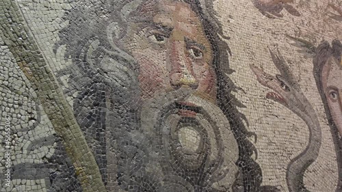 Gaziantep, Turkey - 13th of June 2021: 4K Zoom out close up faces on Oceanus and Thetys mosaics in the Zeugma museum
 photo