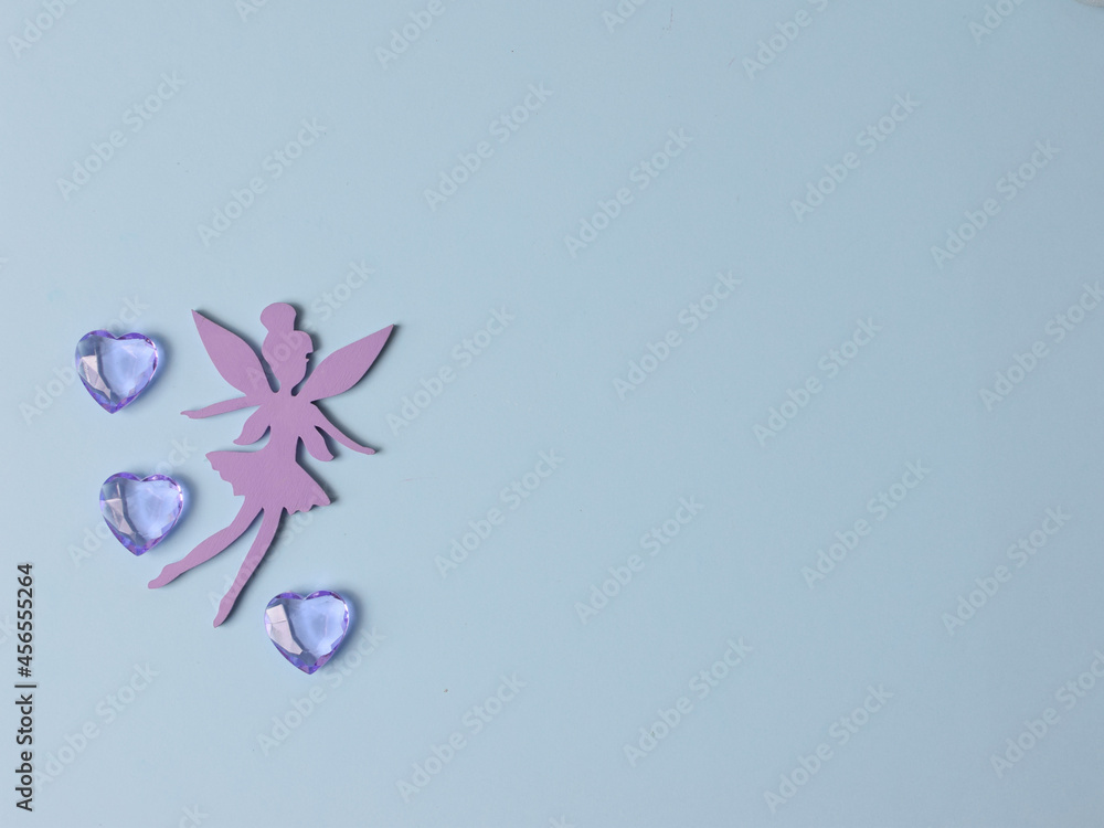 Top view flatlay lie concept view of little small Fairy, color background angel, background for children's party, fairy tale Top view flatlay lie concept view of little small Fairy, color background angel, background for children's party, fairy tale